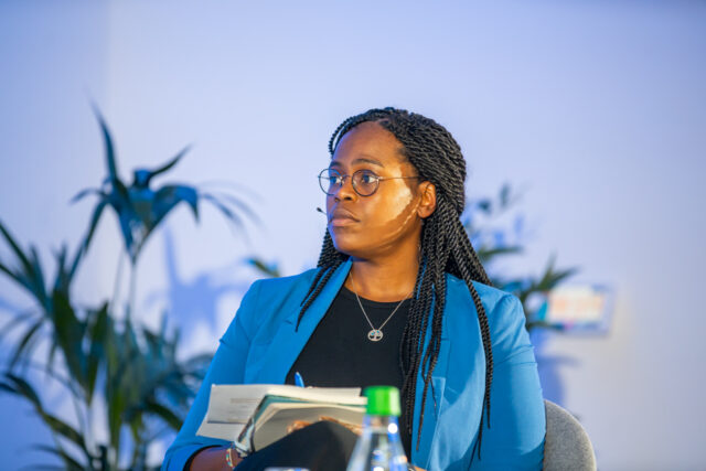 Photograph of Asha Allen, Secretary-General of CDT Europe, speaking at POLITICO Live's "AI & Elections: Are Democracies Ready?" event. 
